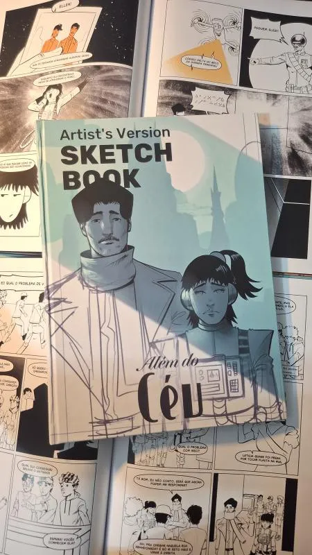Printed Beyond the Sky sketchbook placed over comic pages